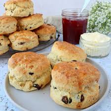 Scones with raisins, strawberry jam with creamy filling